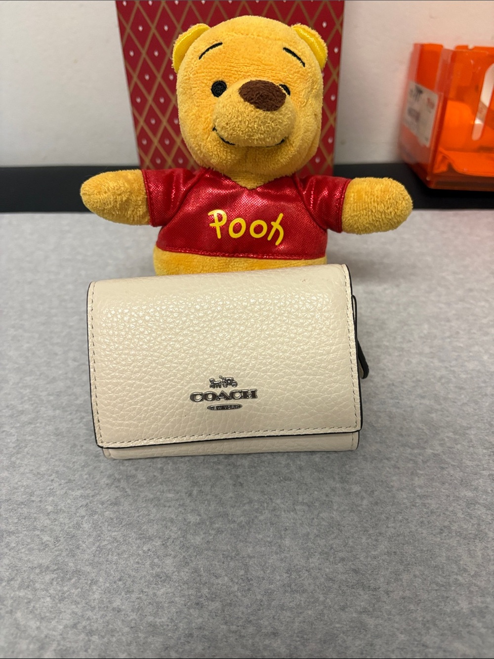 Coach Pebbled Leather Trifold Wallet in Cream